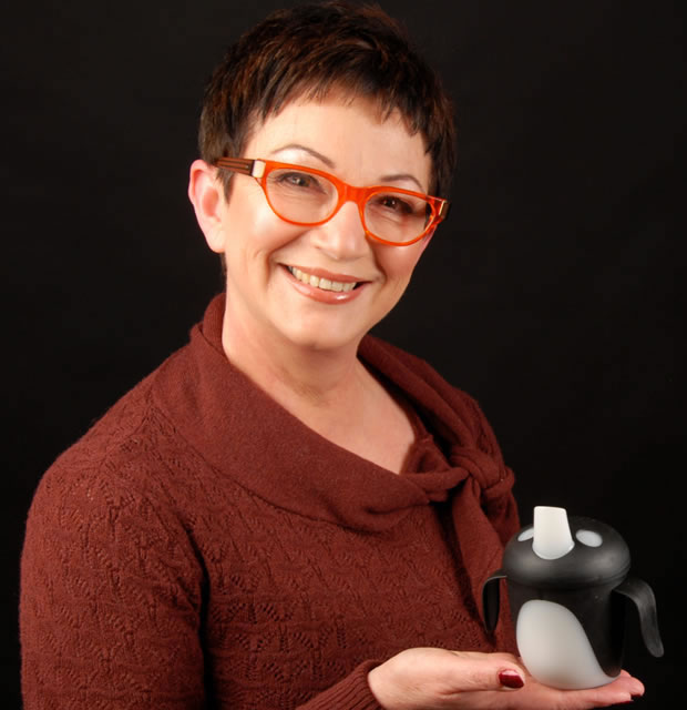 Mandy Haberman holding the Penguin cup on black background
